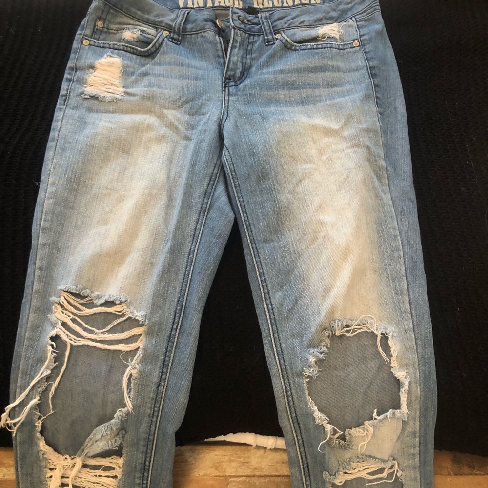 Light wash mid rise ripped jeans